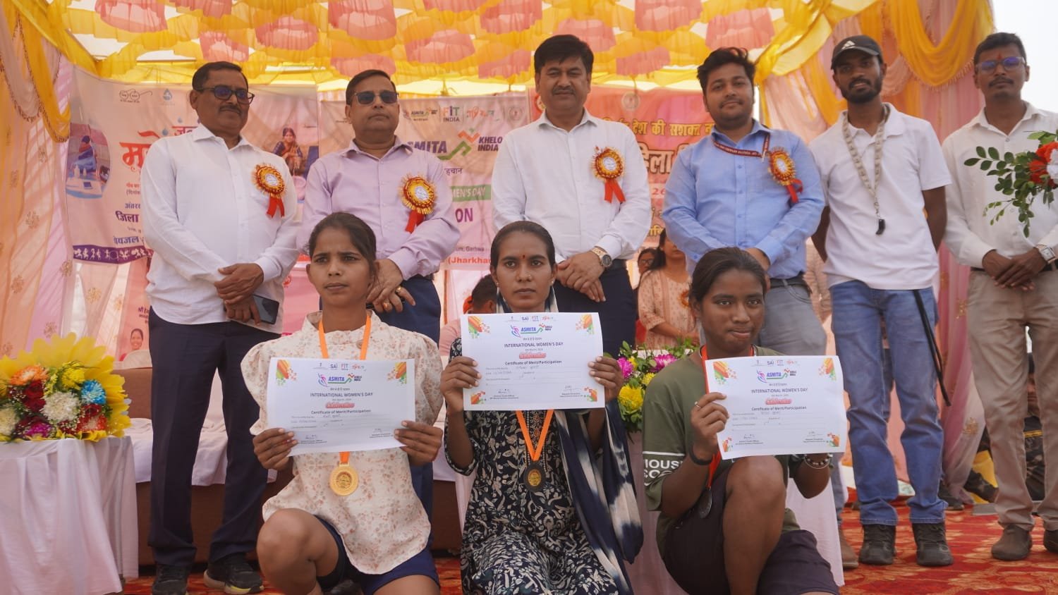 Award ceremony with participants holding certificates.